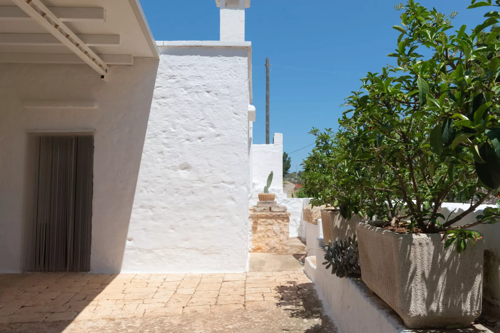 Trulli di Nonno Marco Cisternino-Tuinen zomer