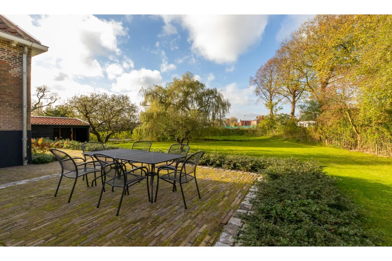 Vakantiehuis 'Boerderij Molenhof' - Stationsweg 5  Heinkenszand-Terrasbalkon