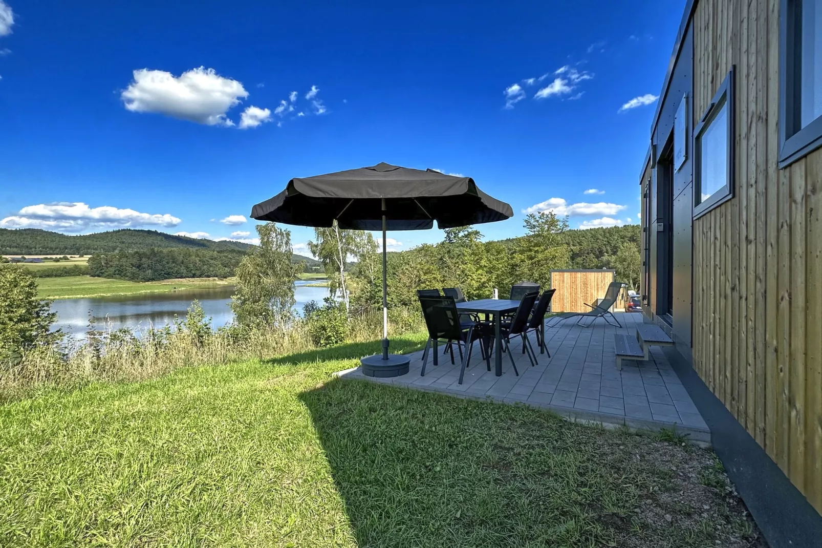 FERIENDORF SEEBLICK - Tiny Chalet am Eixendorfer See-Tuinen zomer