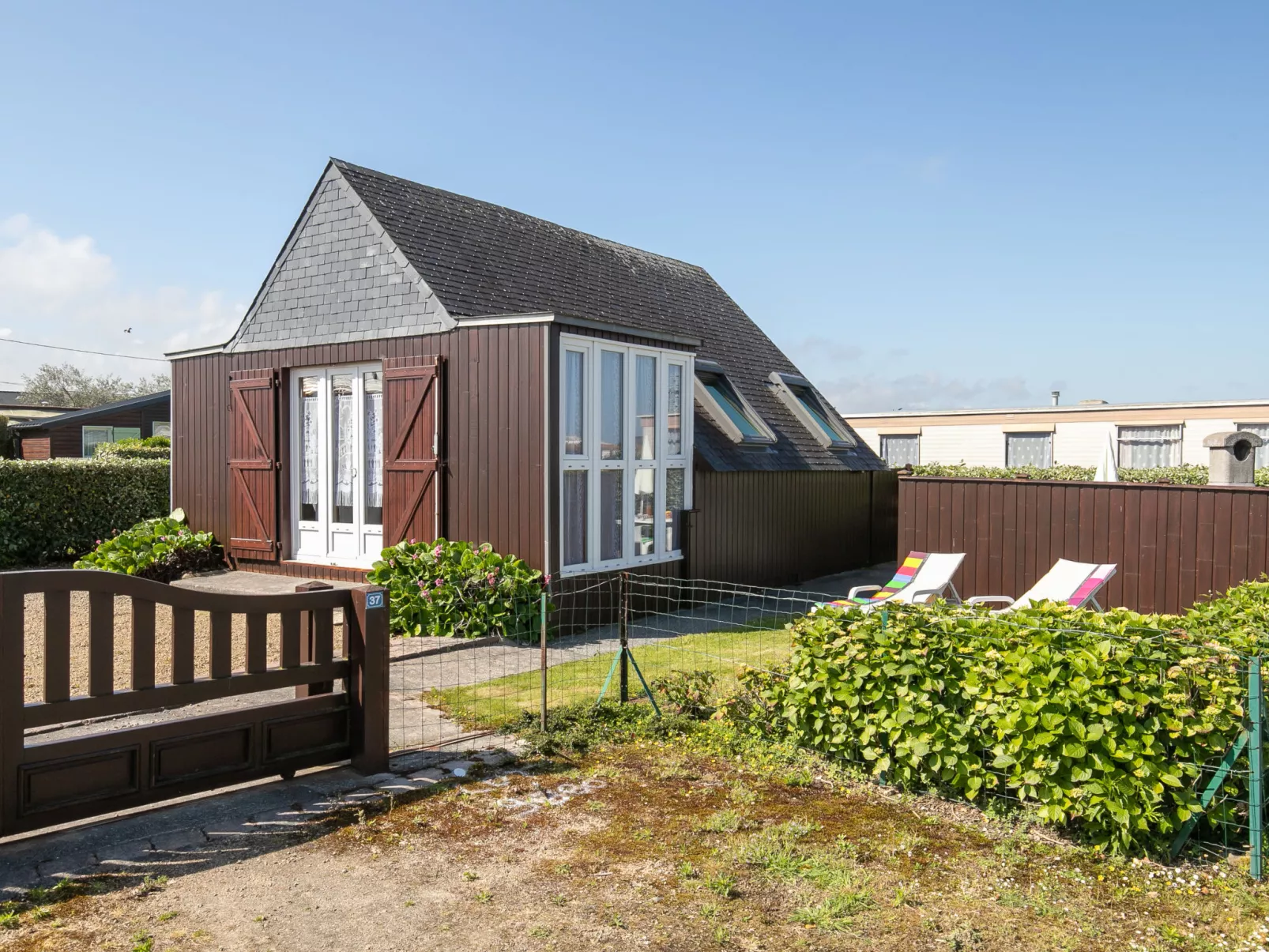 Petit Chalet à la Plage-Buiten