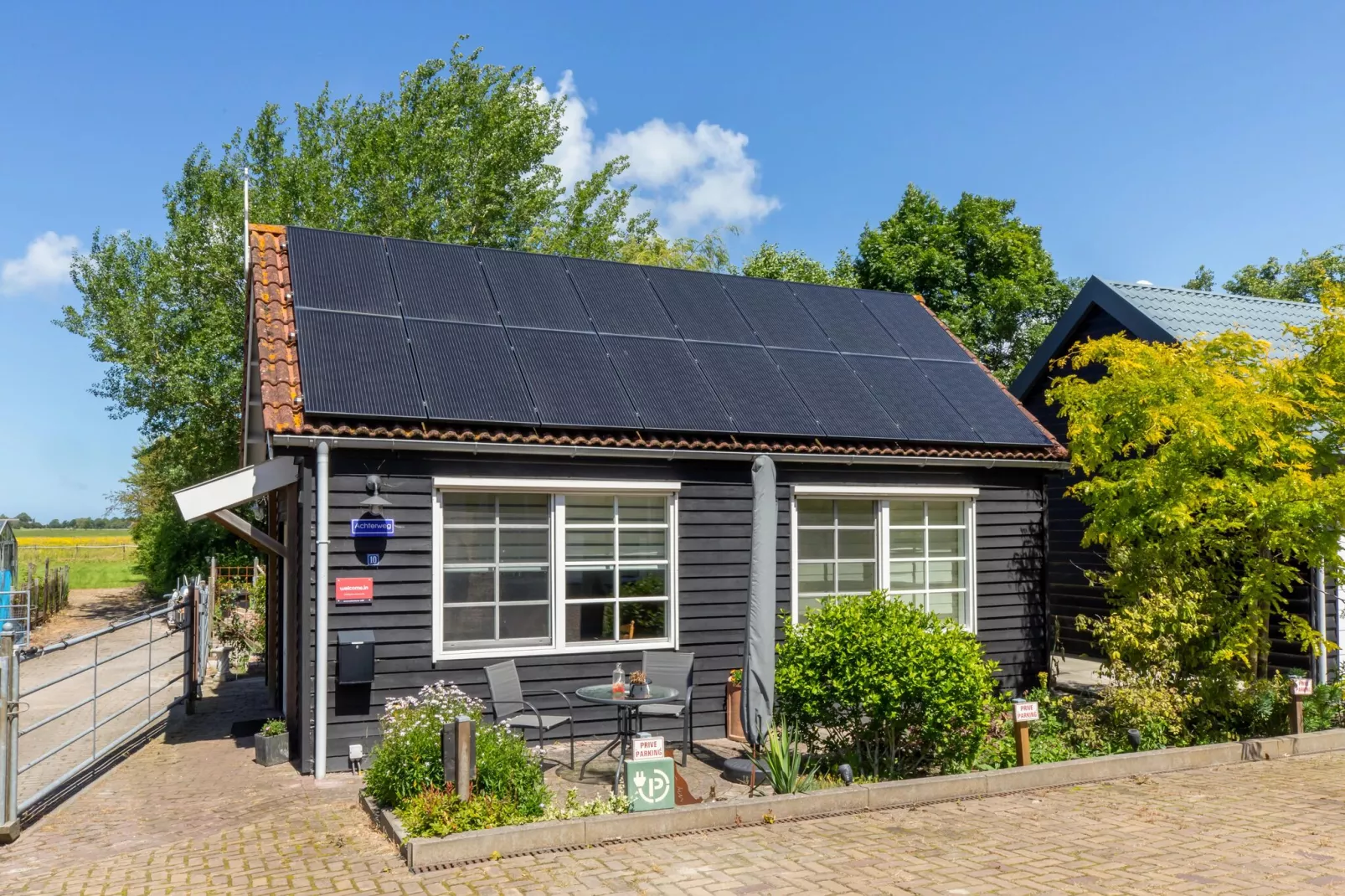 Achterweg 10 l Zonnemaire 'Sol e Mar'-Buitenkant zomer