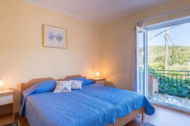 Apartments Saulan - One Bedroom Apartment with Balcony and Garden View (Molunat)-Slaapkamer